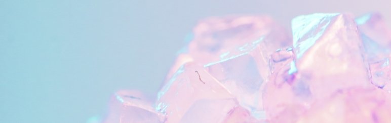 close up image of pink and blue shiny crystal